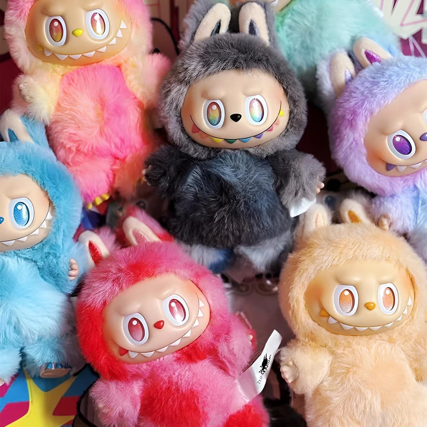 Collection of colorful plush toys with cartoonish faces.