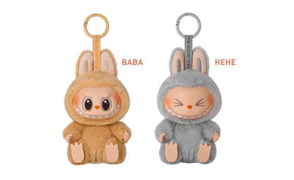 Two plush keychains, one brown and one gray, with 'BABA' and 'HEHE' text on a white background.
